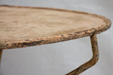 Early 20th century French garden table with ochre patina