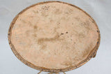 Early 20th century French garden table with ochre patina