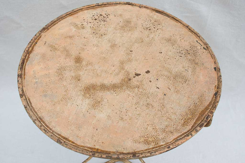 Early 20th century French garden table with ochre patina
