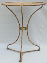Early 20th century French garden table with ochre patina