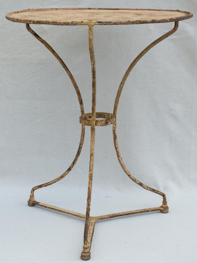 Early 20th century French garden table with ochre patina