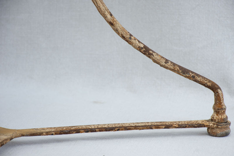 Early 20th century French garden table with ochre patina