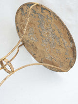 Early 20th century French garden table with ochre patina