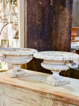 Pair of antique French cast iron garden urns with white patina