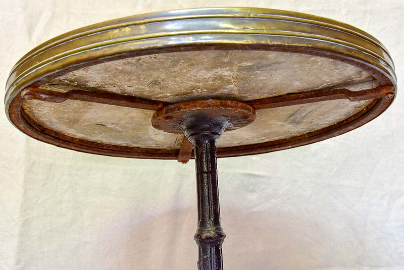 Early 20th-century bistro table with marble top and cast iron base