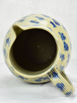 Rustic French pitcher with blue spots
