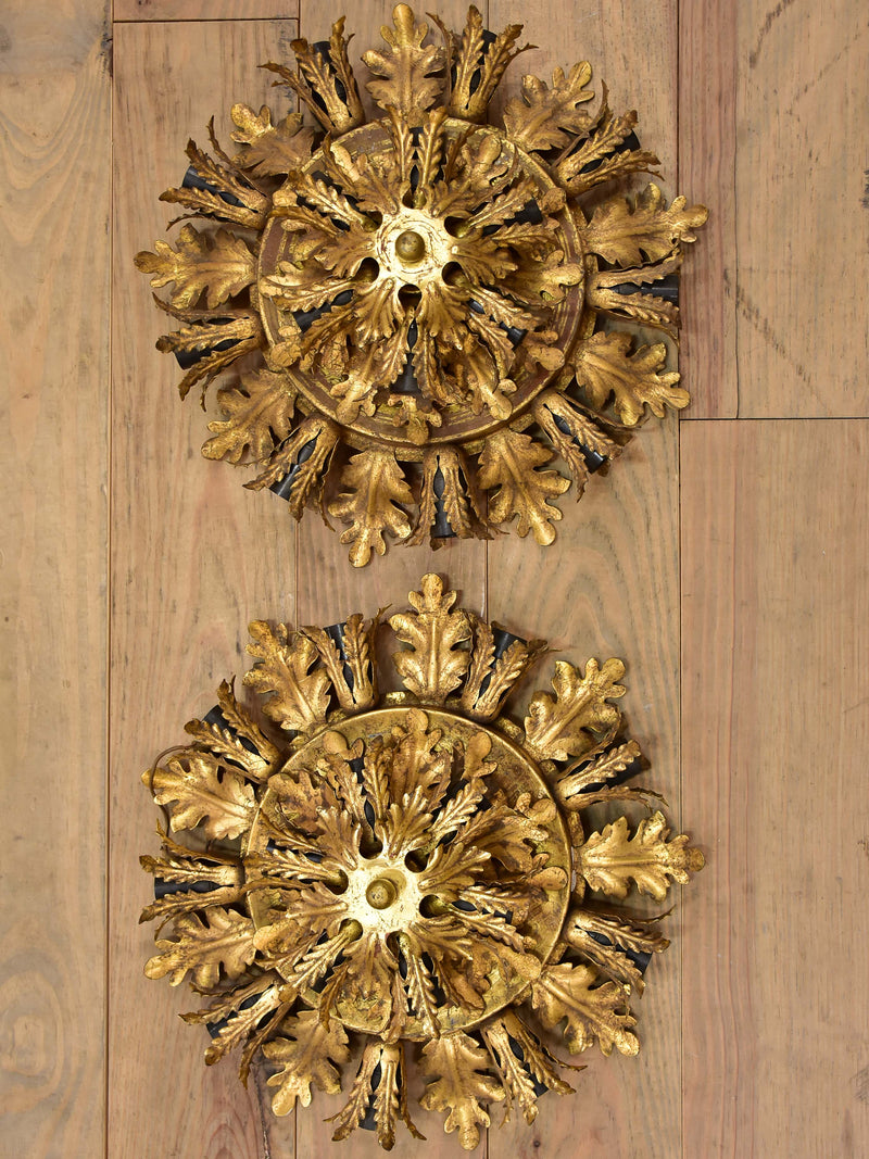 Pair of Maison Charles wall sconces / ceiling lights with gold leaves