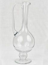 Antique and long-handled blown glass carafe