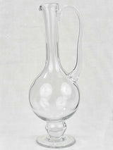 Pedestal style historical glass carafe