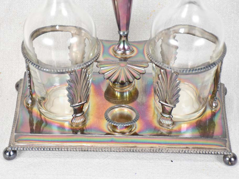 Two crystal carafes in a silver carrier