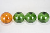 Collection of four vintage glass fishing floats 5"