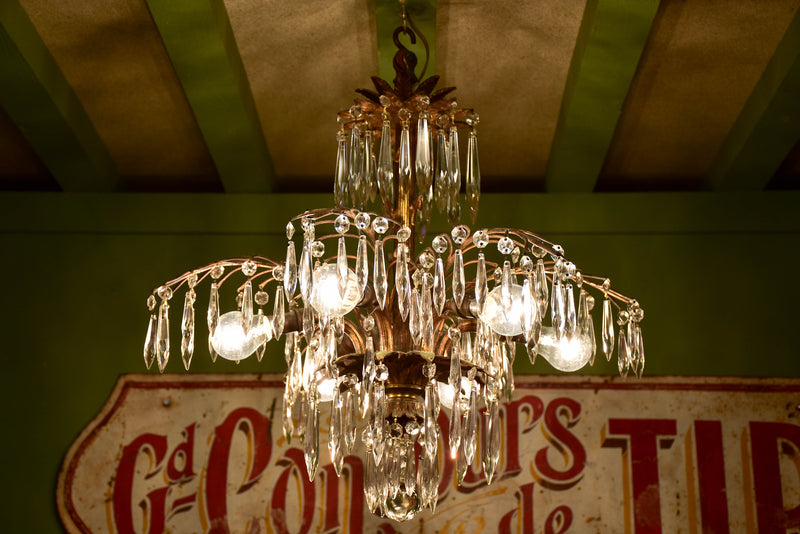Gold palm frond chandelier with crystals