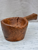Primitive wooden bowl with handle
