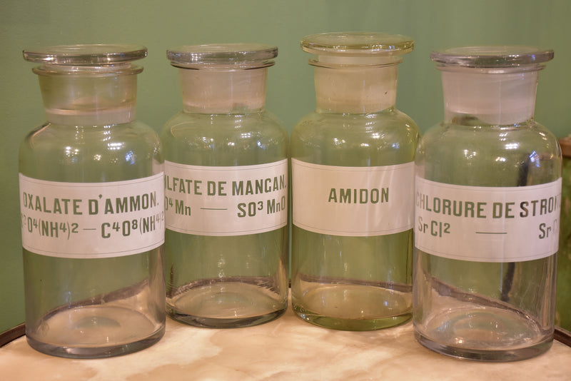 Four antique French apothecary glass jars