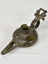 Ancient bronze Roman-era oil lamp