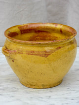 Antique French mixing bowl with yellow glaze
