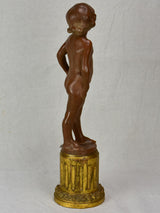 Eary 20th Century French terracotta sculpture of a boy on a gilded column - signed