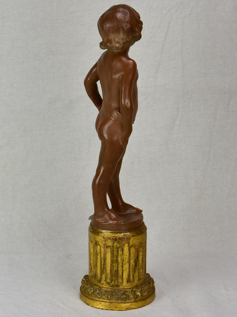 Eary 20th Century French terracotta sculpture of a boy on a gilded column - signed