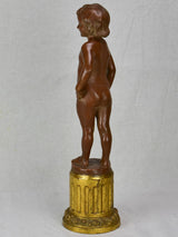 Eary 20th Century French terracotta sculpture of a boy on a gilded column - signed