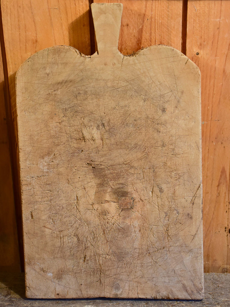 Antique French cutting board with rounded shoulders