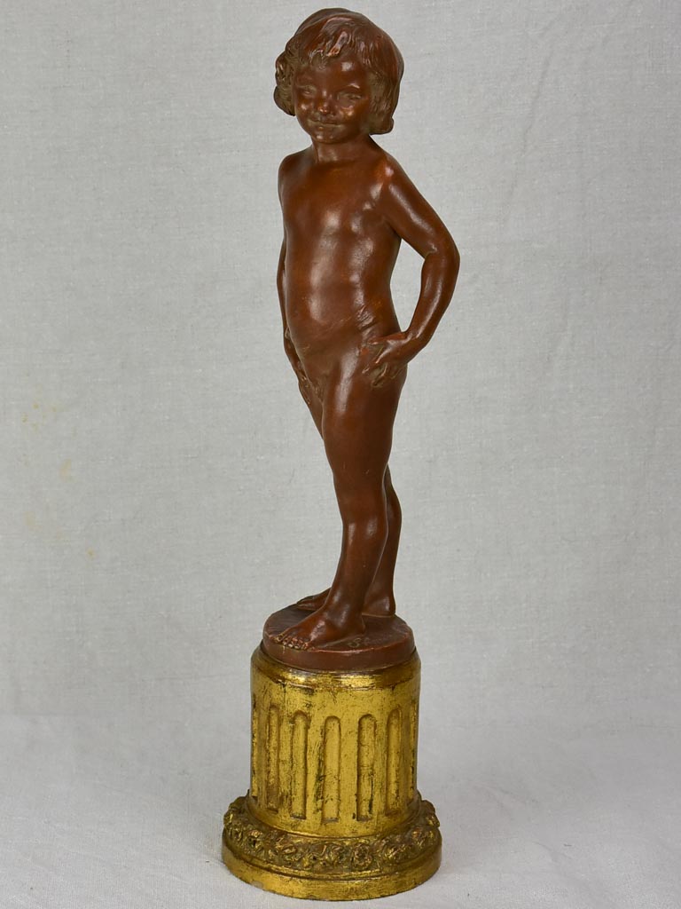 Eary 20th Century French terracotta sculpture of a boy on a gilded column - signed