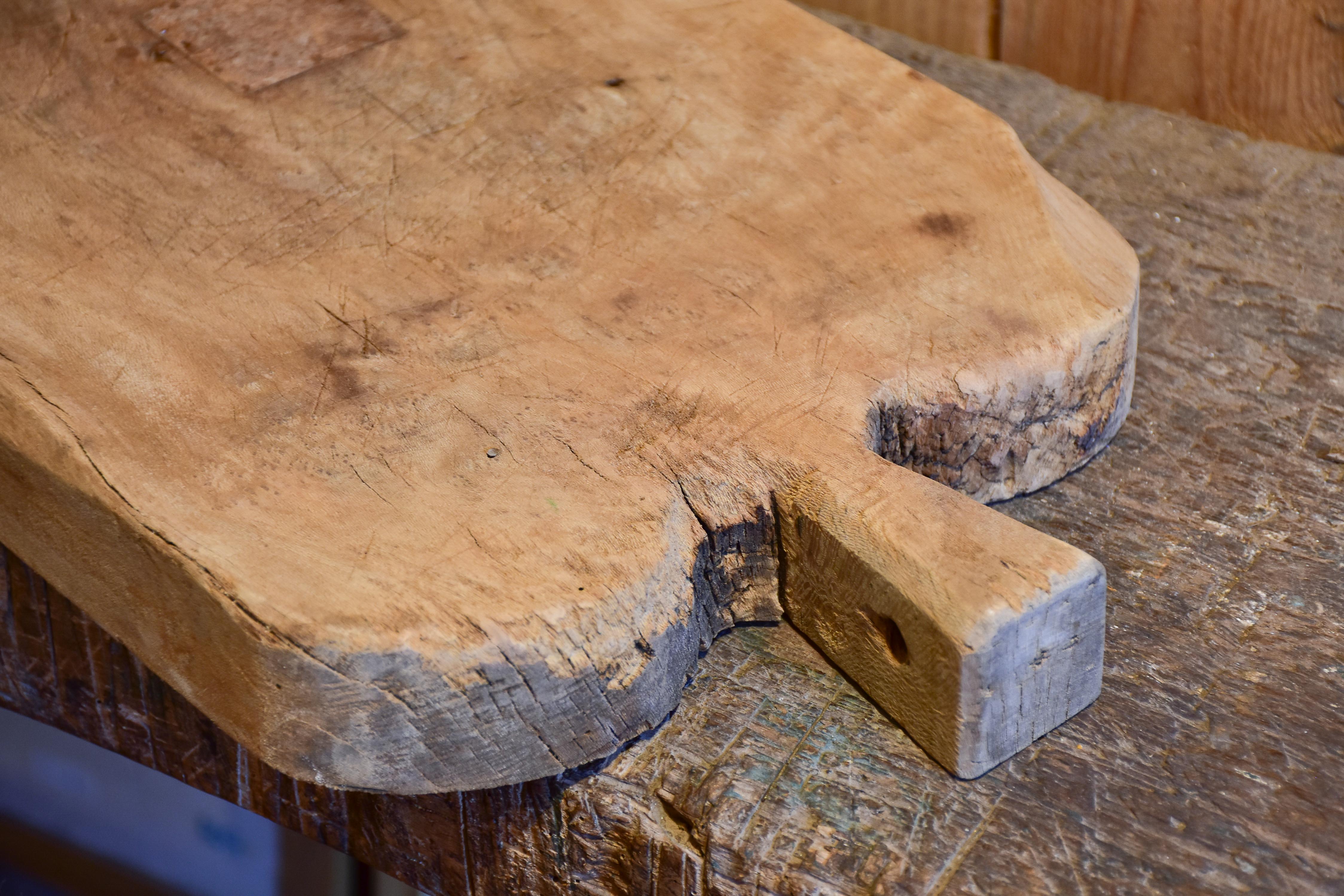 Antique French cutting board with rounded shoulders