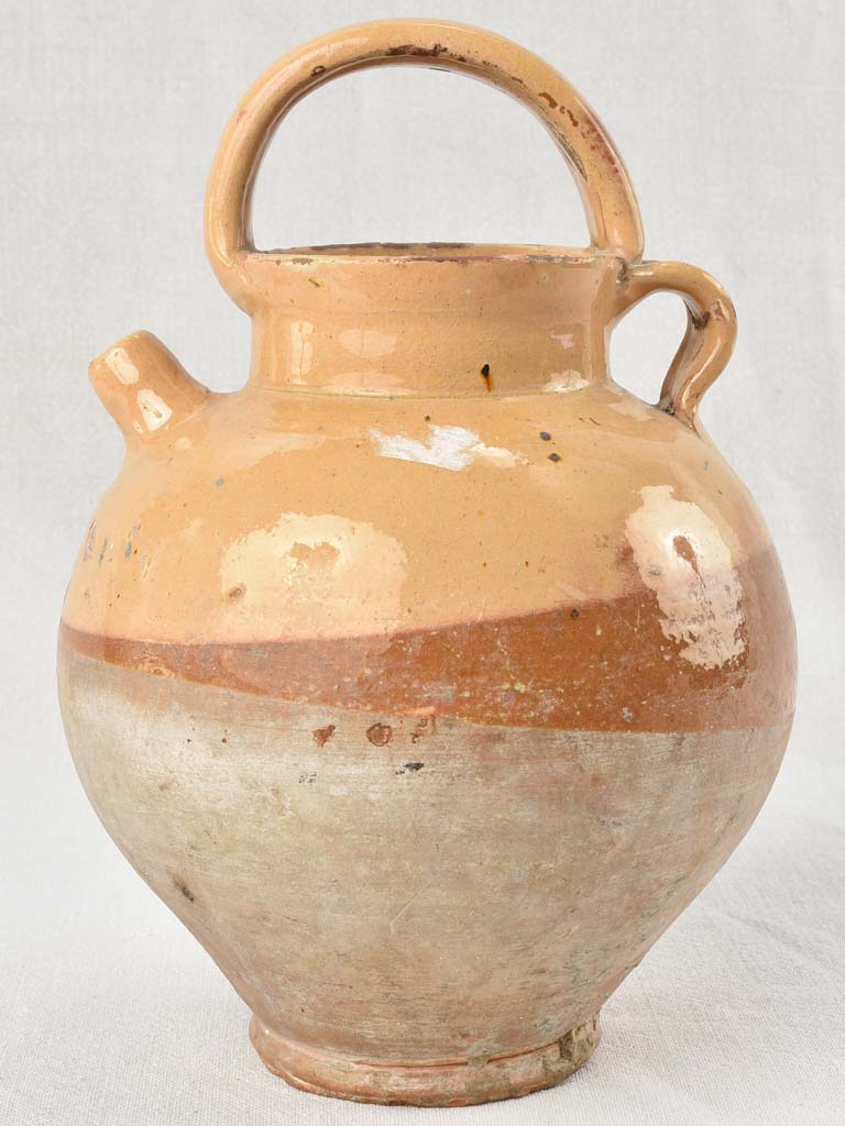 Antique French water pitcher with yellow / peach glaze 11¾"