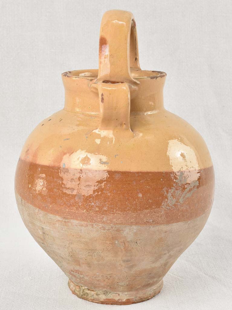 Antique French water pitcher with yellow / peach glaze 11¾"