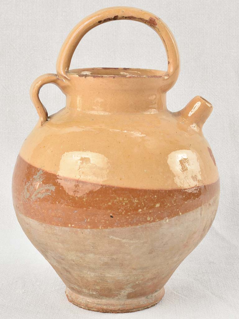 Antique French water pitcher with yellow / peach glaze 11¾"