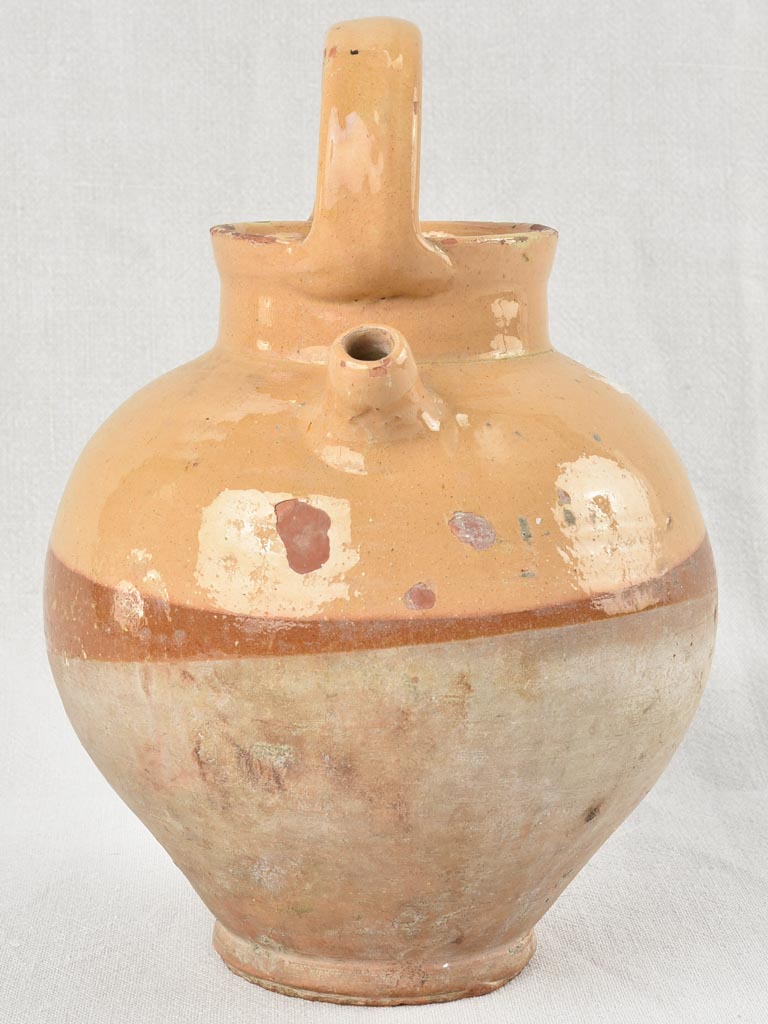 Antique French water pitcher with yellow / peach glaze 11¾"