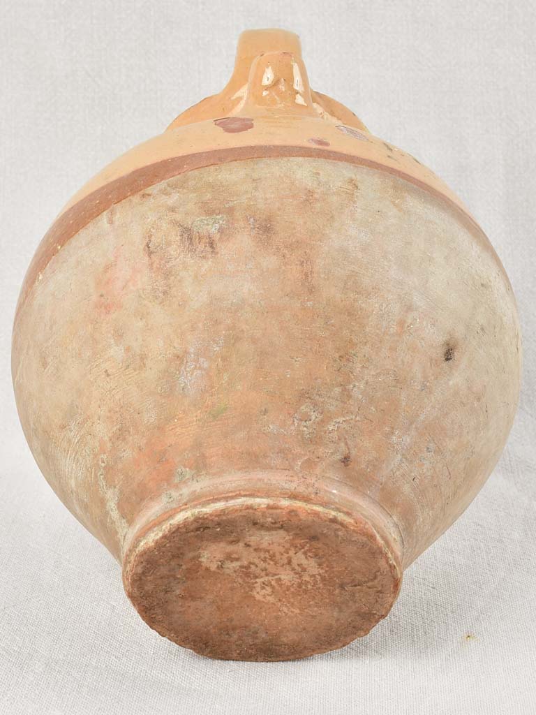 Antique French water pitcher with yellow / peach glaze 11¾"