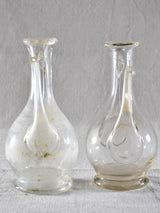 Two eighteenth-century blown glass oil pitchers