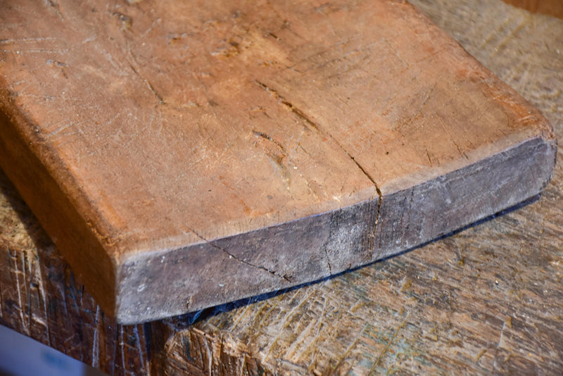 Antique French cutting board with wedge handle