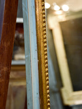 Narrow rectangular Louis Philippe mirror with gilded and sage green frame