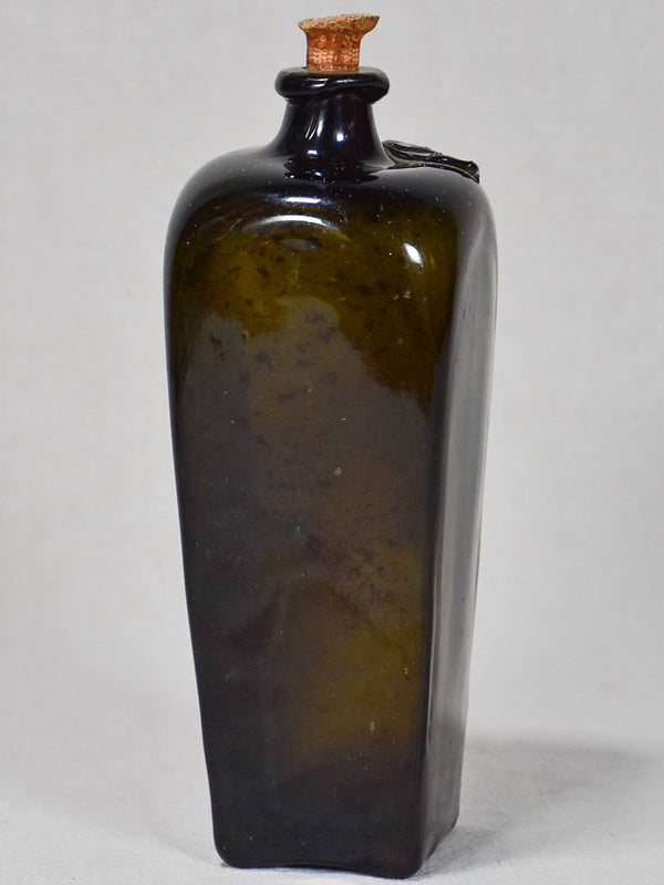 Antique 17th-century English rum bottle