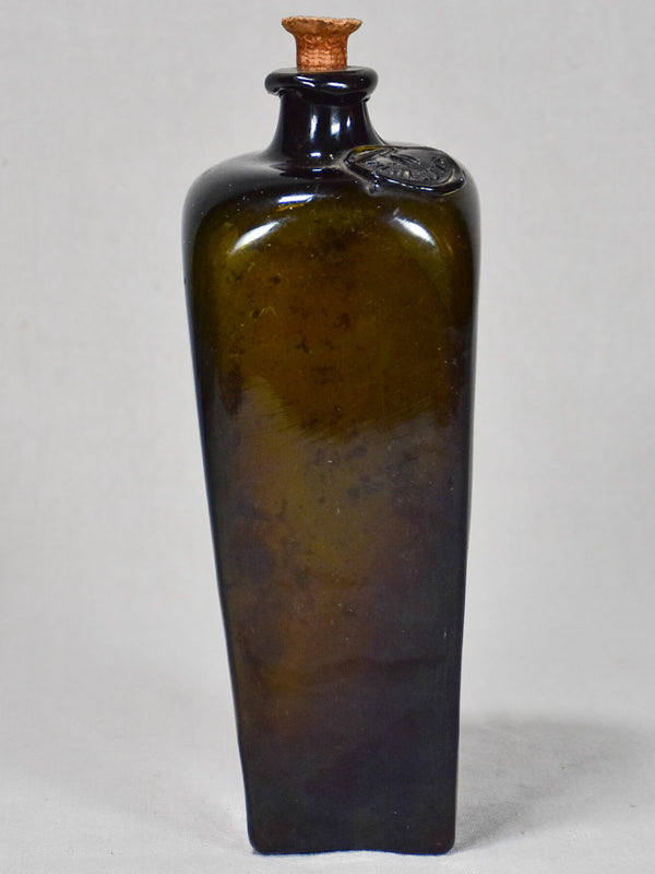 Unusual square-shaped glass rum bottle