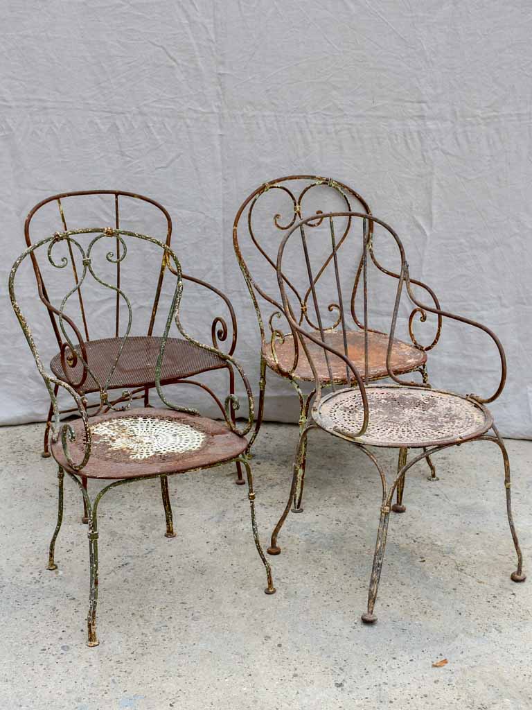 Collection of four antique French garden armchairs