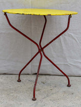 Folding antique French garden table with yellow table top and red legs