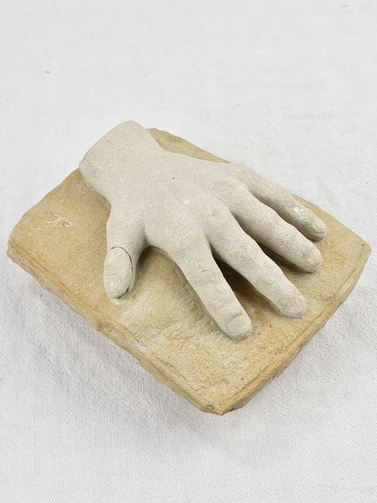 Antique stone sculptured hand, discreetly repaired