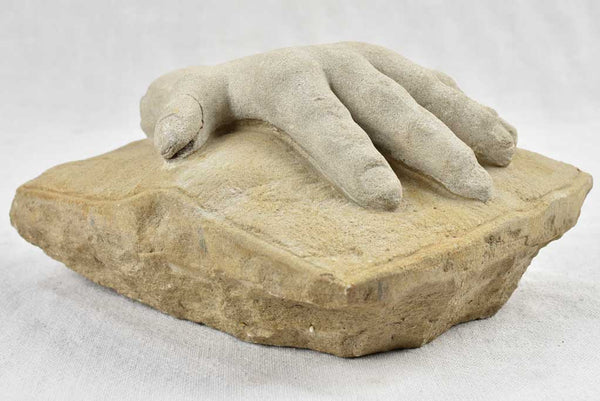 Antique stone sculpture of a hand