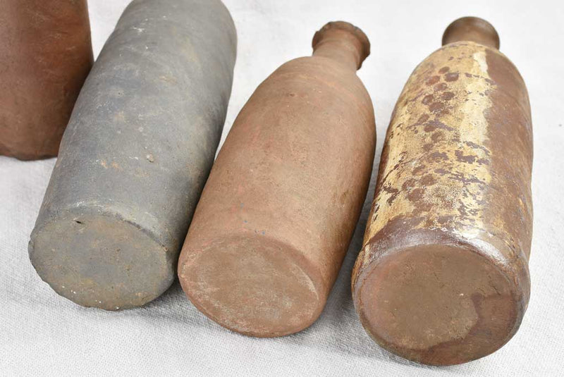 Collection of 11 antique Ger sandstone long bottles 11¾"