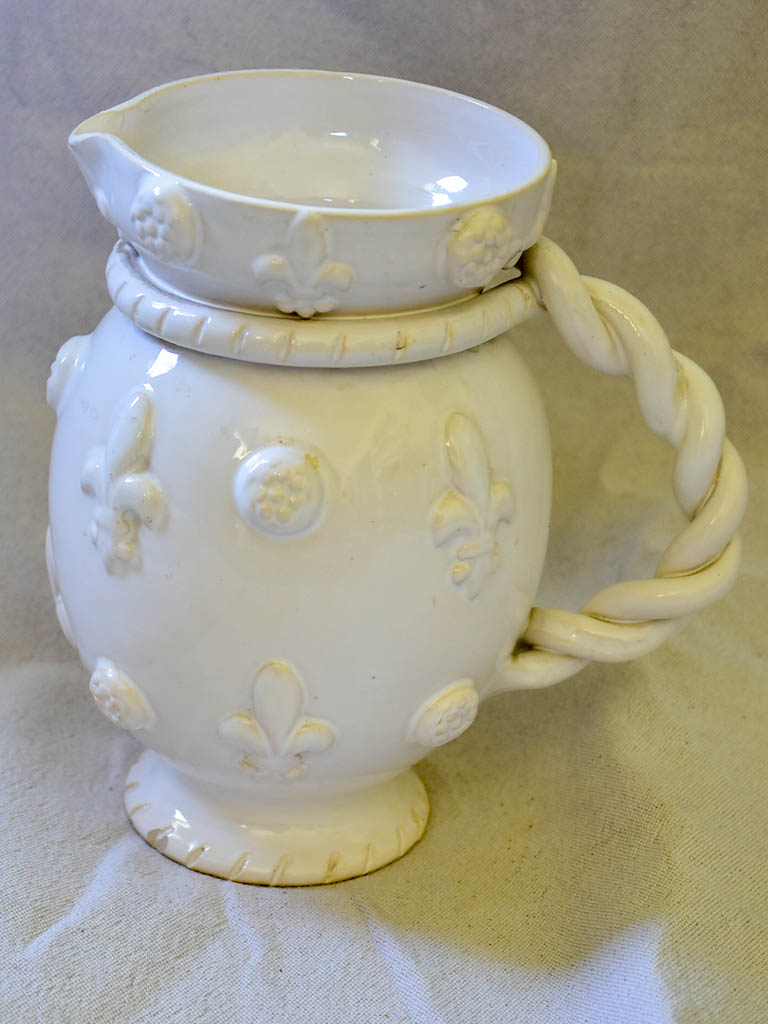 1960's Émile Tessier white ceramic pitcher with fleur de lys