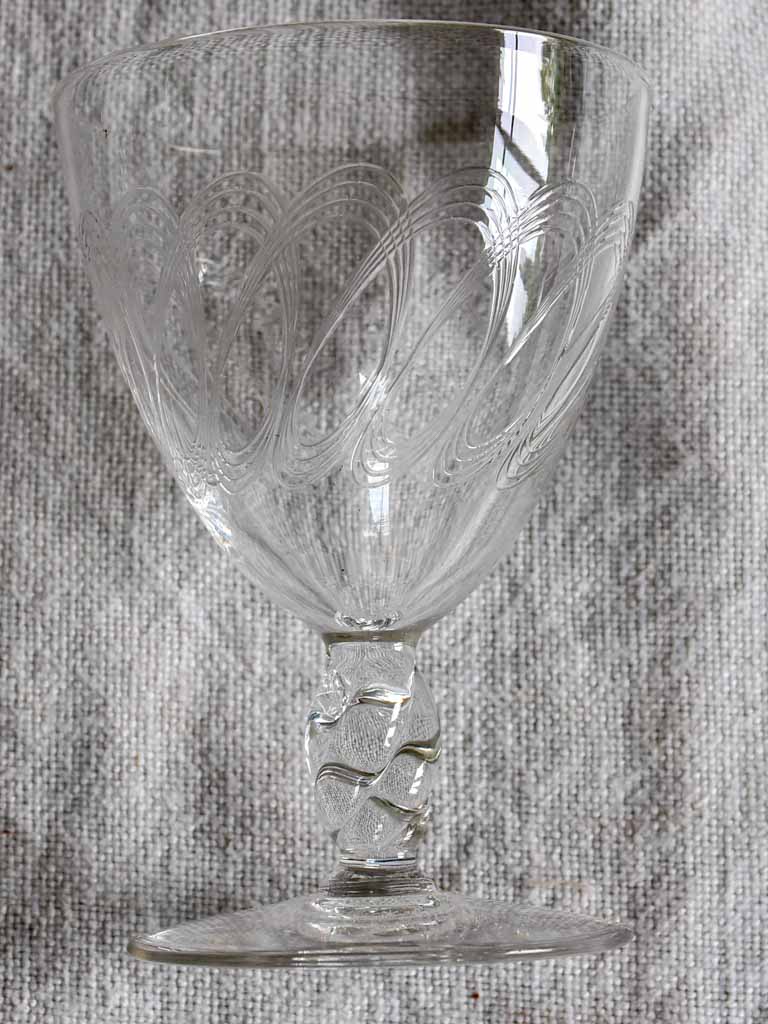 Nine mid-century white wine glasses with pretty engraving