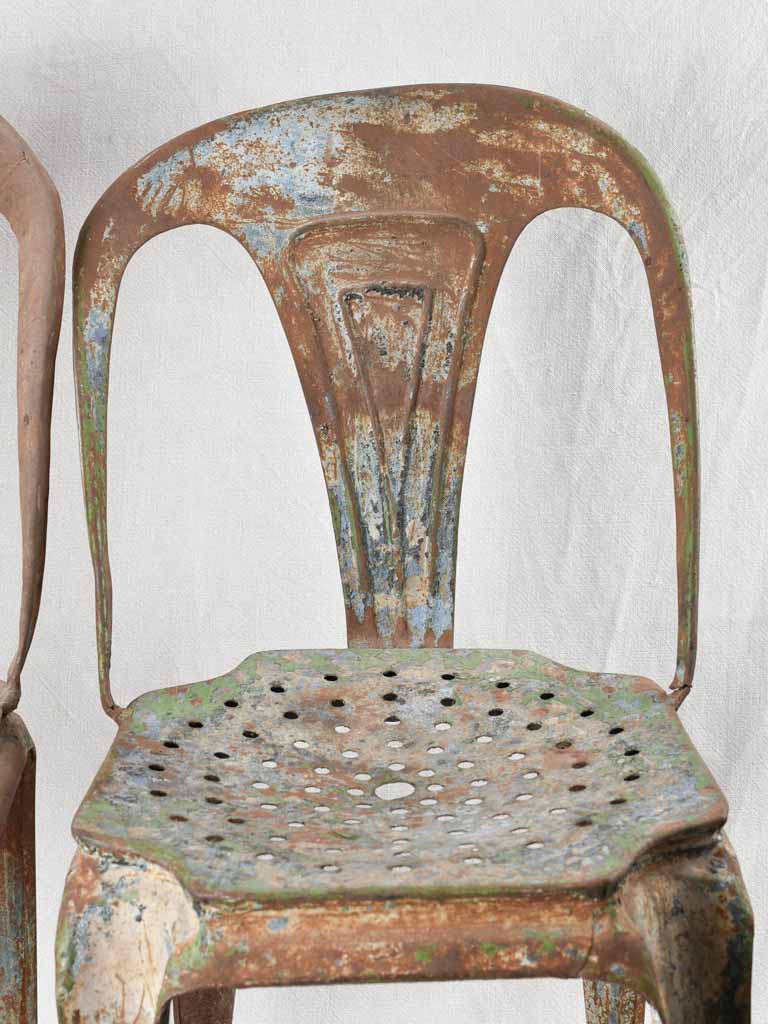 Antique stackable metal Tolix chairs