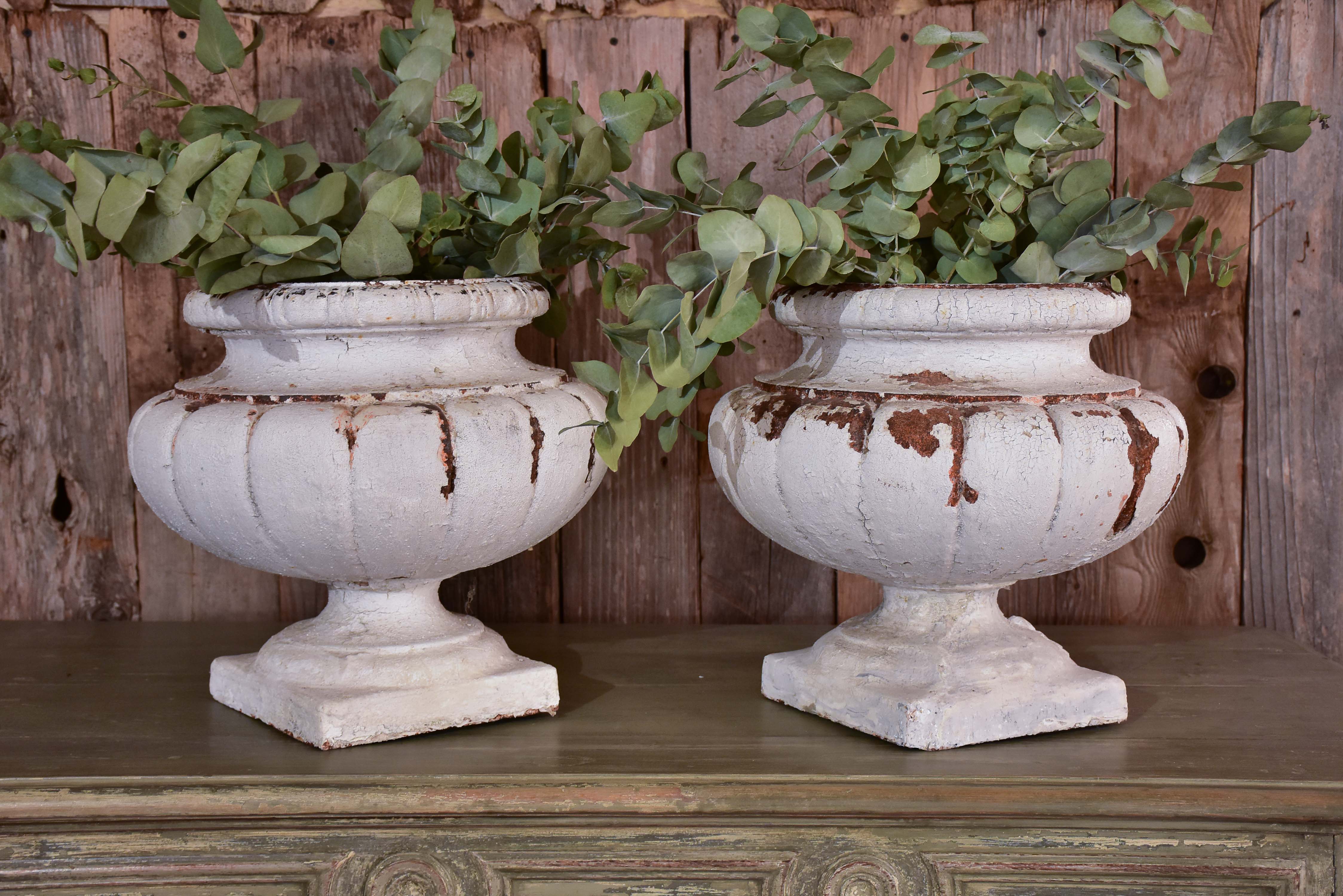 Two vintage French garden urns with white patina