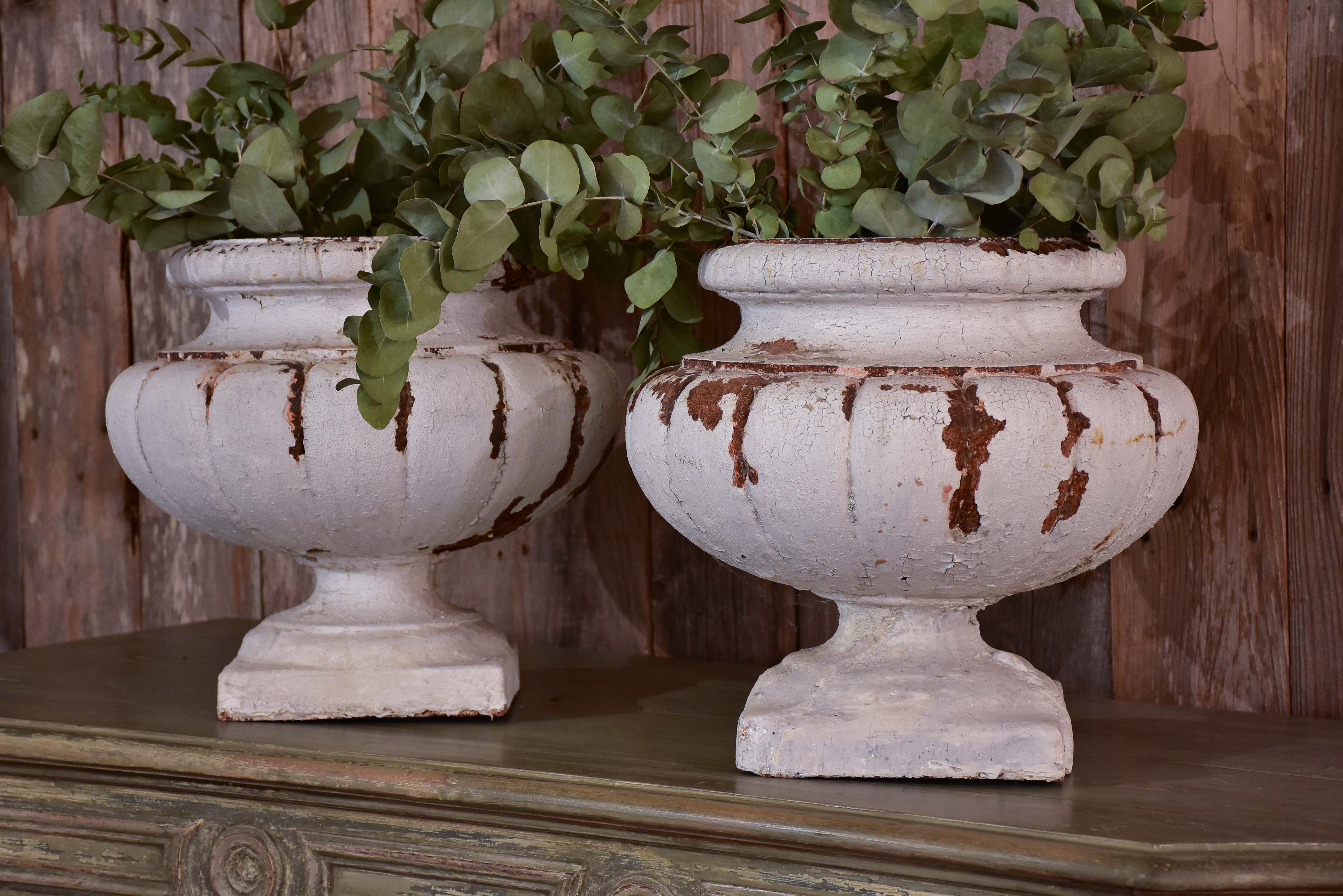 Two vintage French garden urns with white patina