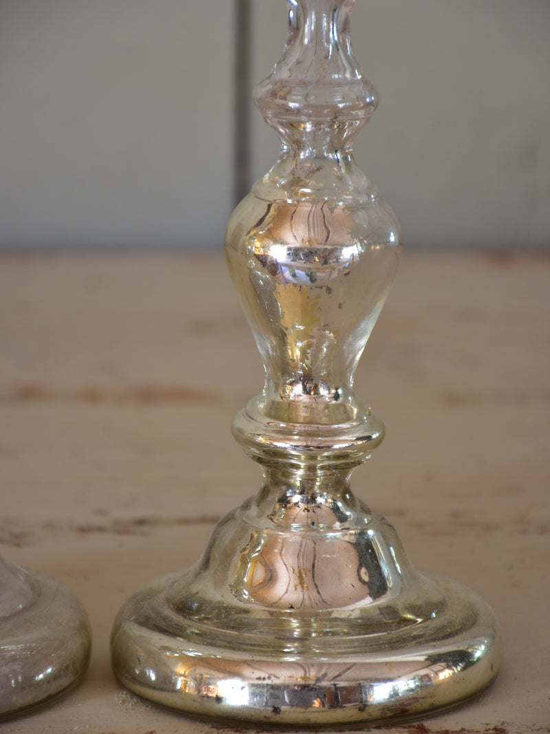 Two antique candlesticks, rustic mercury glass