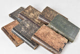 Collection of eight worn leatherbound books