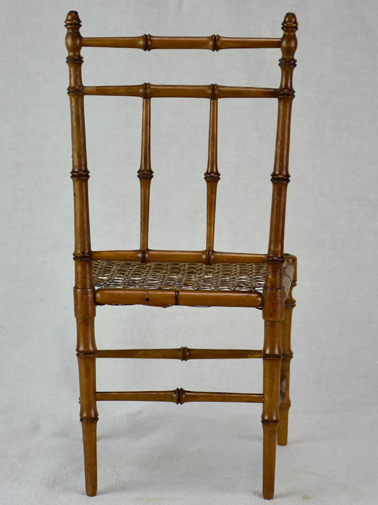 Miniature antique French chair with bamboo frame and cane seat