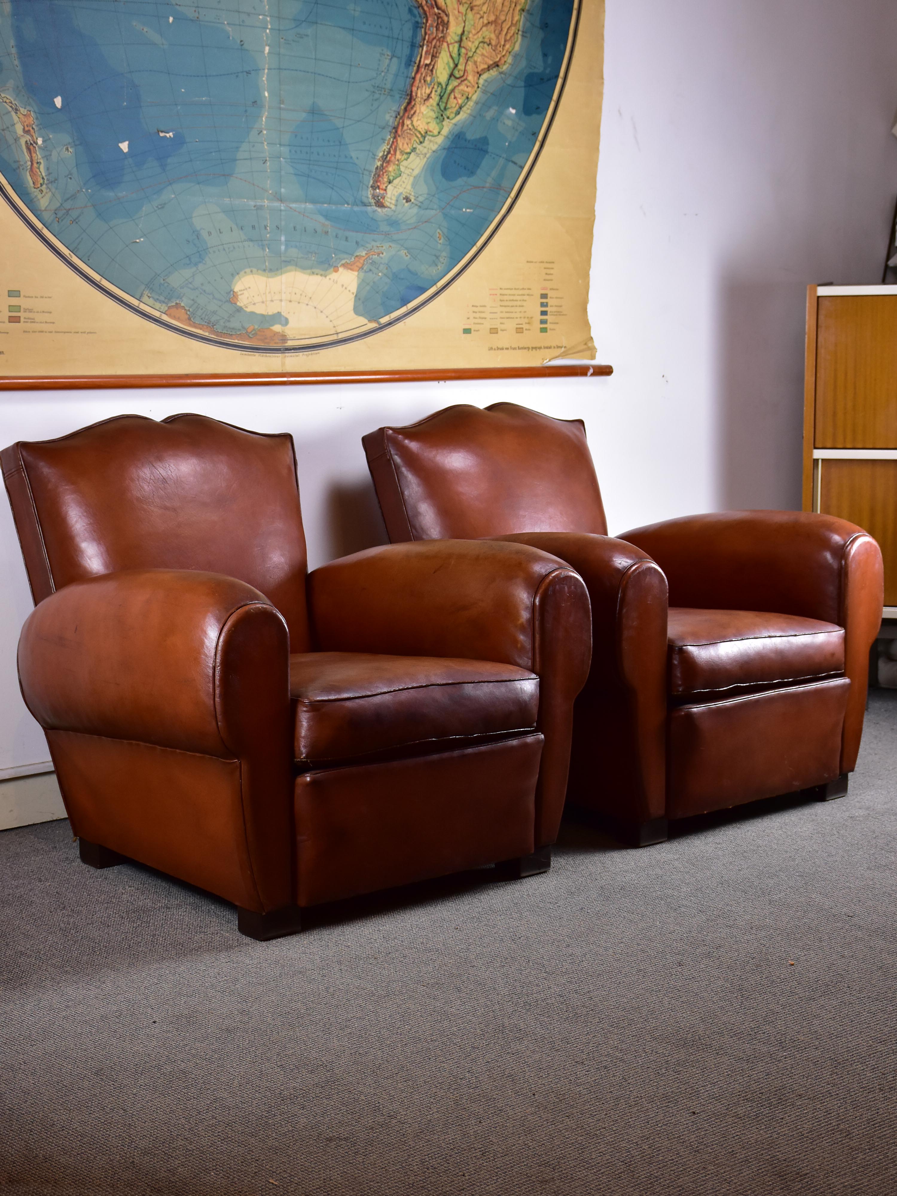 Pair of moustache back French leather club chairs
